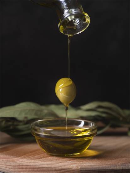 close-up-oil-dipping-into-bowl